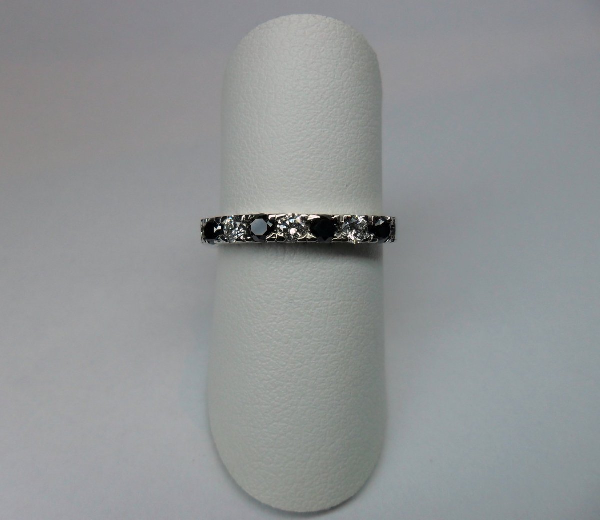Row ring with black diamonds